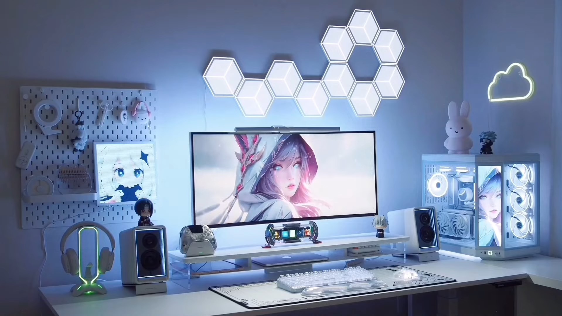 A white-themed PC build complete with gaming gear